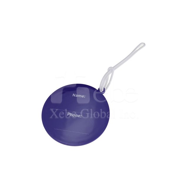 round purple luggage tag